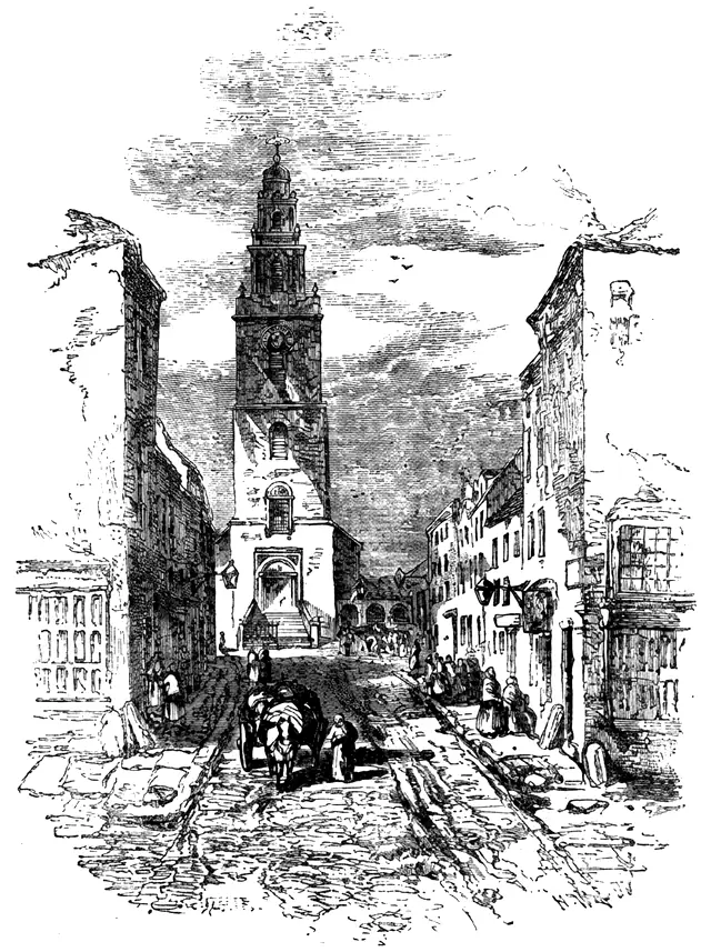 Engraving of the stepped stone tower of St Anne's, Shandon, Cork, rising above a narrow street with a horse and cart, after an engraving of 1865.